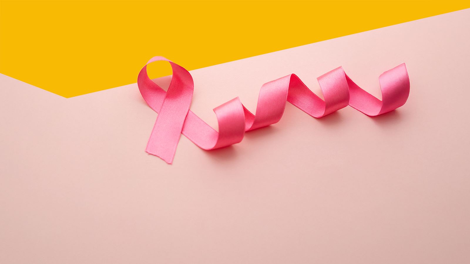 The Swiss Cancer League’s pink awareness ribbon (yellow triangle overlying)