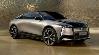The DS No. 8 electric car showcased in a glossy finish against a stylish copper-brown background (with an overlaid yellow design element).